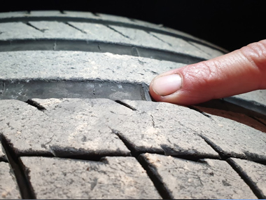 Inspection of a Porsche Panamera 4 tyre shows excessive wear and will need to be replaced Tyre tread wear indicator